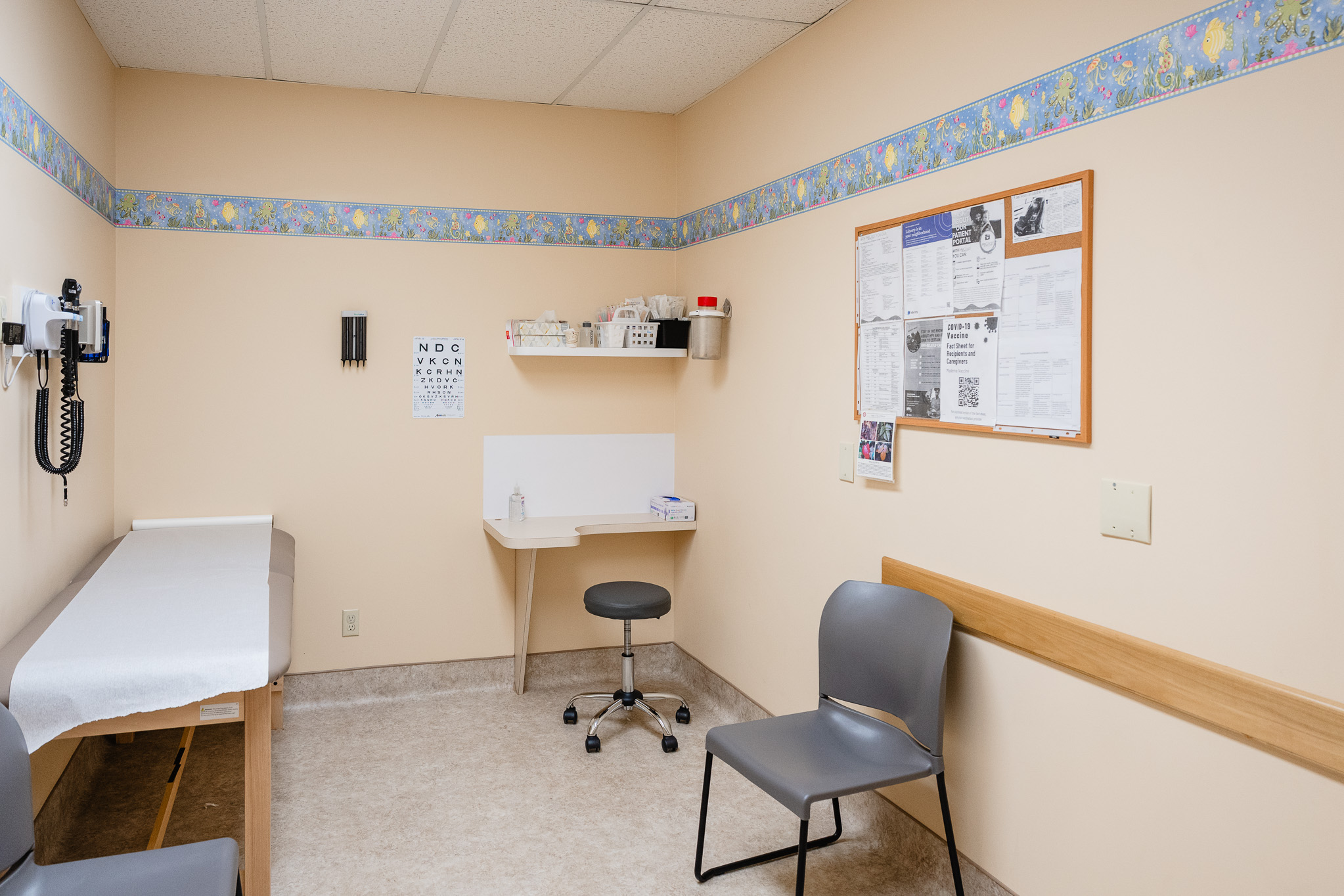 an empty pediatric exam room
